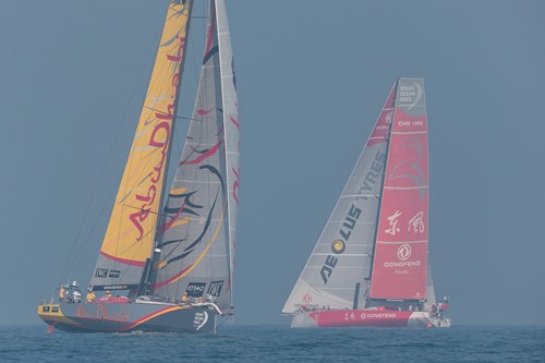 Abu Dhabi Ocean Racing lead the fleet out of a fog-shrouded Abu Dhabi on the way to Sanya - Photo by Ian Roman - Abu Dhabi Ocean Racing.jpg