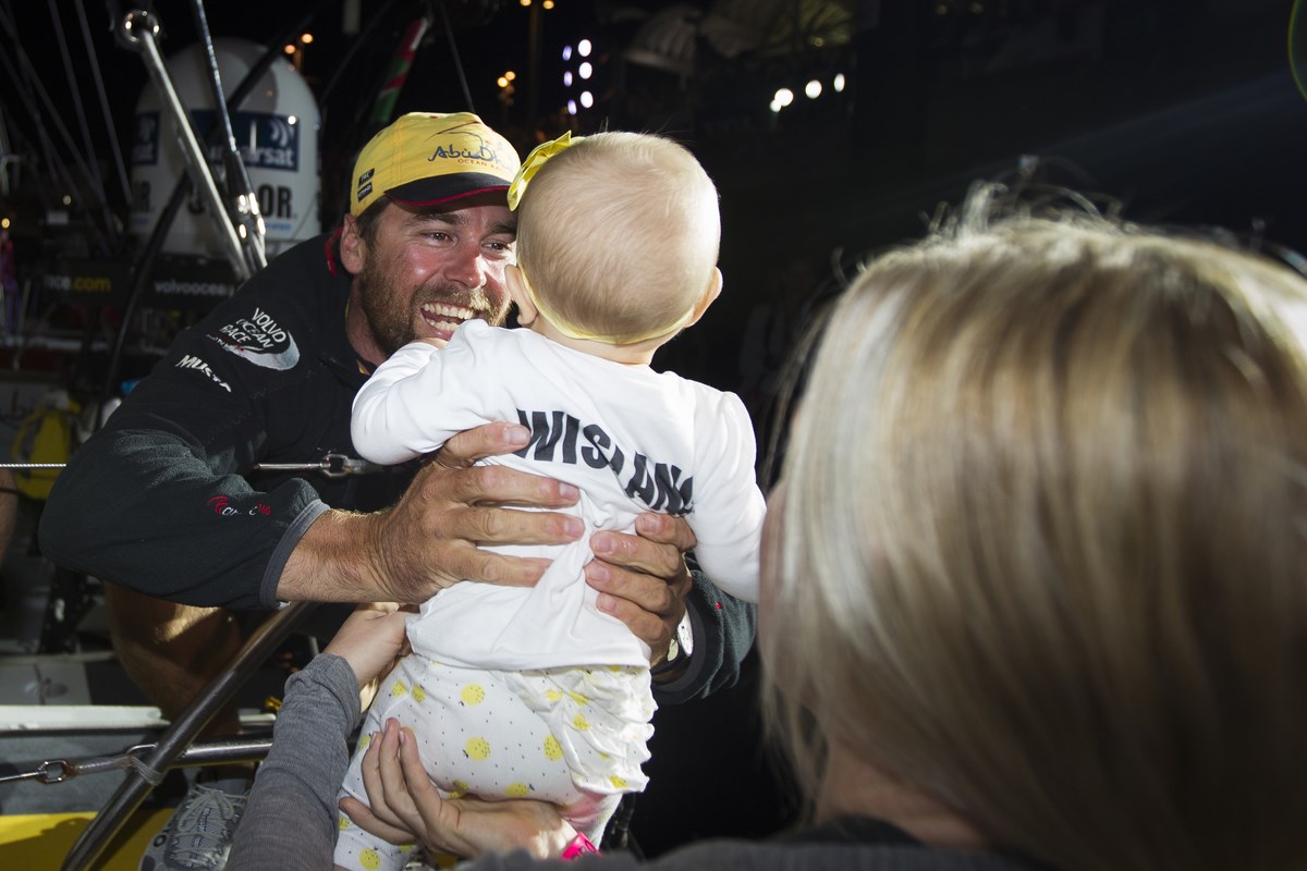 Kiwi Boat Captain Daryl Wislang had a happy homecoming in New Zealand, meeting his wife and baby daughter at dock-in - Photo by Ian Roman - Abu .jpg