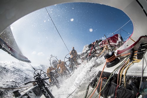 Big seas and 20 knots of boatspeed crash into the cockpit as the crew braces for the spray on Leg 4 of the Volvo Ocean Race  Picture by Matt Knighto.jpg (1)