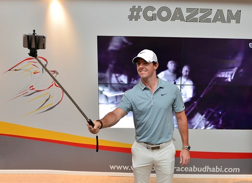 Rory McIlroy takes a 'selfie' with ADOR's Ian Walker and Justin Slattery on the video screen behind..jpg