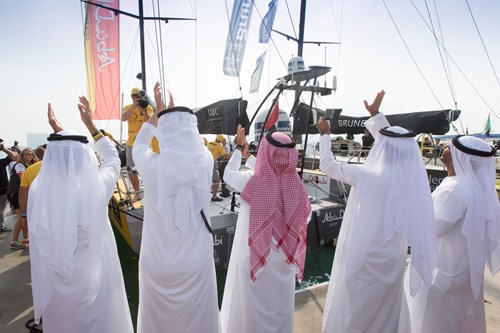 Dignitaries from Abu Dhabi Tourism & Culture Authority wave Azzam off the Abu Dhabi pontoons - Photo by Ian Roman - Abu Dhabi Ocean Racing.jpg